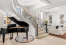 A gold-domed New York City penthouse first listed for $25 million has sold for $9 million